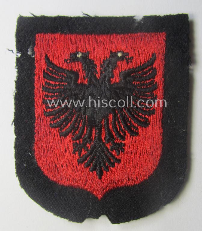 Waffen-SS 'volunteer'-arm-shield as was intended for usage by soldiers of the: '21. Waffen-Grenadier-Division der SS' “Skanderbeg” (ie. 'albanische Nr. 1') and that comes in a 'virtually mint- ie. unissued', condition