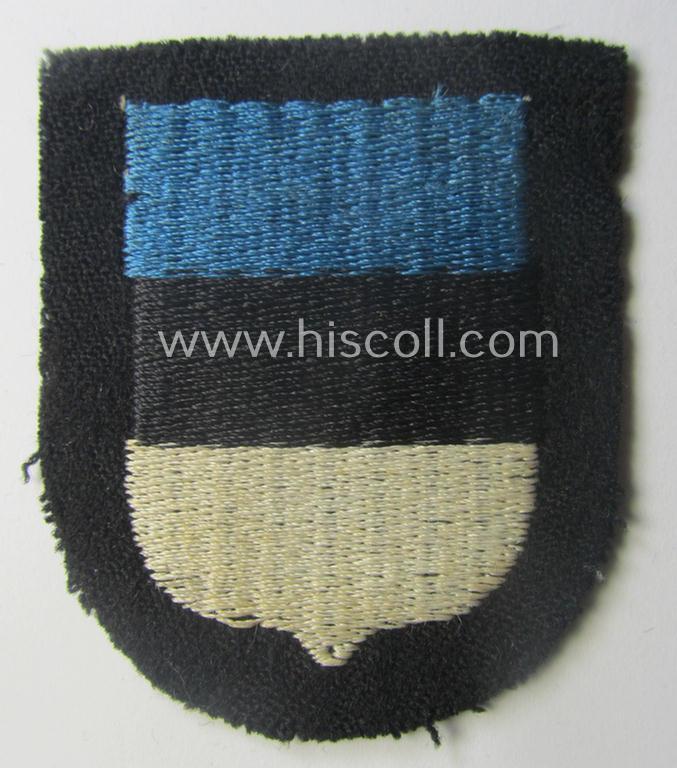 Waffen-SS 'volunteer'-arm-shield as was intended for usage by soldiers of the: '20. Waffen-Grenadier-Division der SS' (ie. 'estnische Nr. 1') and that comes in a 'virtually mint- ie. unissued', condition