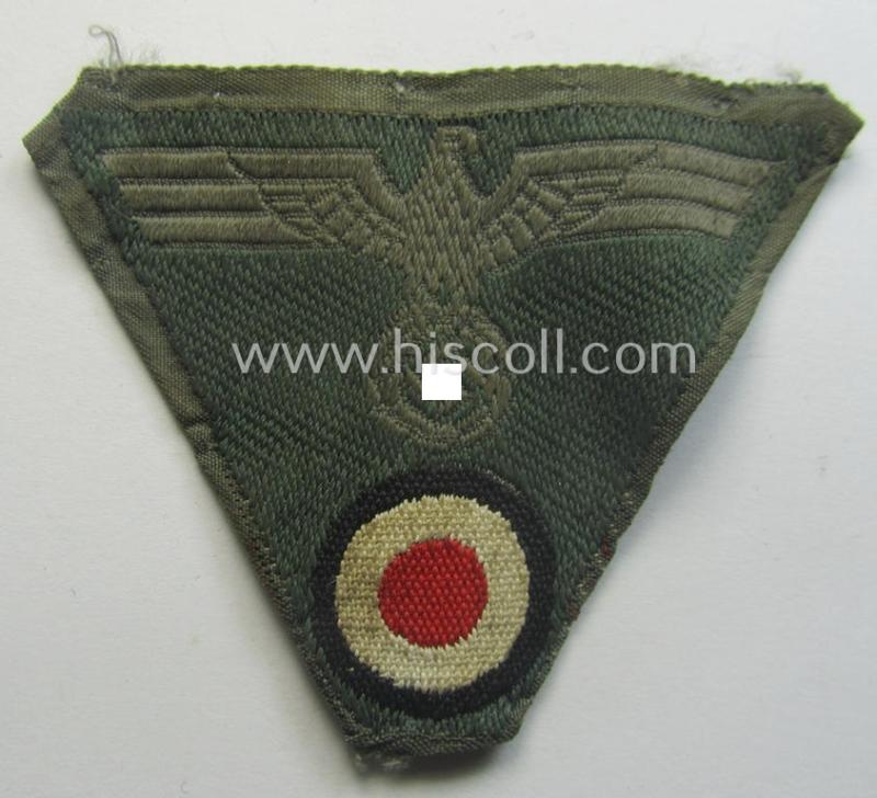 WH (Heeres) so-called: 'M43-pattern') cap-eagle/cocarde (ie. cap-trapezoid) as was specifically produced for usage on the so-called: 'M-43'-model field-caps (ie. 'Einheitsfeldmützen')