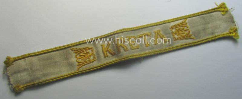Truly worn WH cuff-title (ie. 'Ärmelstreifen') entitled: 'Kreta' (being a period-shortened example that comes in a clearly issued-, worn- and/or most certainly once tunic-attached, condition)