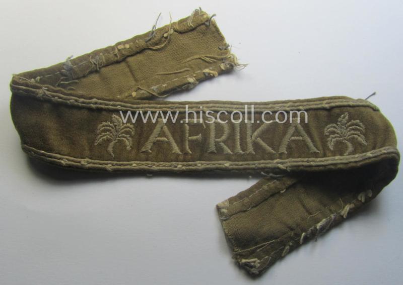 Neat, WH cuff-title (ie. 'Ärmelstreifen') entitled: 'Afrika' that comes in a clearly issued, worn- and/or most certainly once tunic-attached, condition