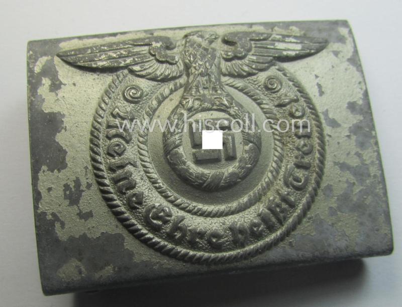 Waffen-SS, EM- (ie. NCO-) type belt-buckle (being a typical, unmarked and typical steel-based: 'Overhoff & Cie'-example) that comes in a surely issued- and/or moderately used- ie. worn, condition
