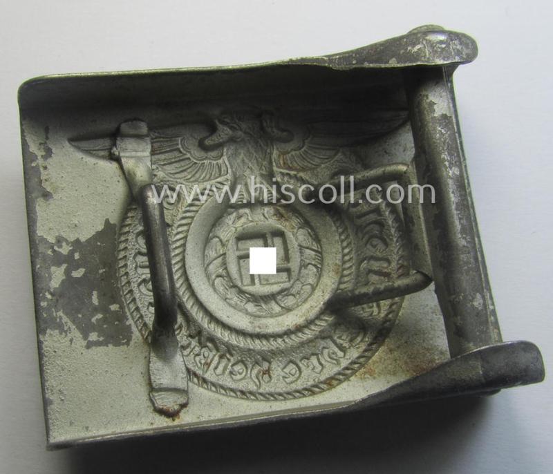 Waffen-SS, EM- (ie. NCO-) type belt-buckle (being a typical, unmarked and typical steel-based: 'Overhoff & Cie'-example) that comes in a surely issued- and/or moderately used- ie. worn, condition