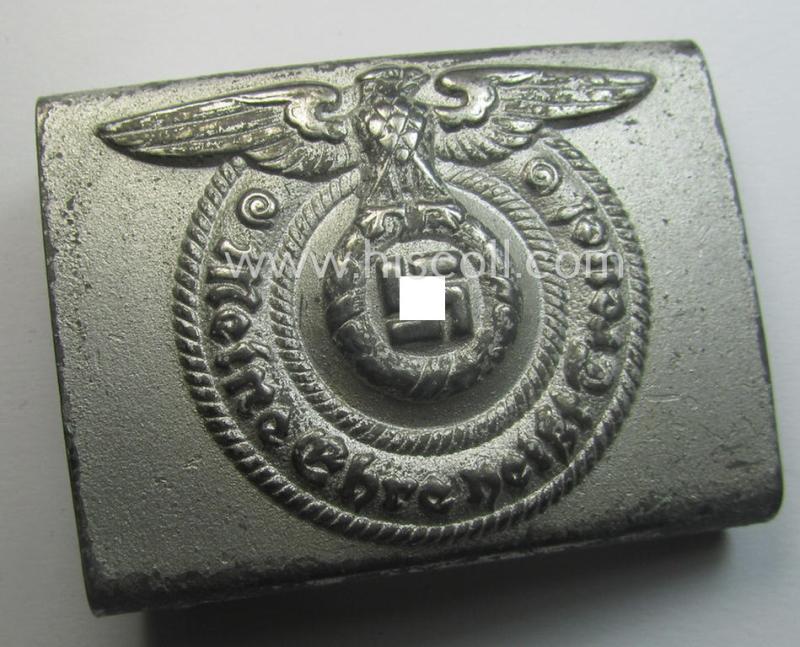 Waffen-SS, EM- (ie. NCO-) type belt-buckle (being a typical, unmarked and typical steel-based: 'Overhoff & Cie'-example) that comes in a surely issued- and/or moderately used- ie. worn, condition