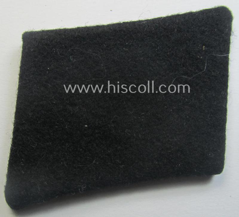 Waffen-SS EM-pattern rank-collar-rank-tab ('Kragenspiegel') being a 'standard-issue'-pattern example as executed in black-coloured wool as was intended for usage by an: 'SS-Mann'