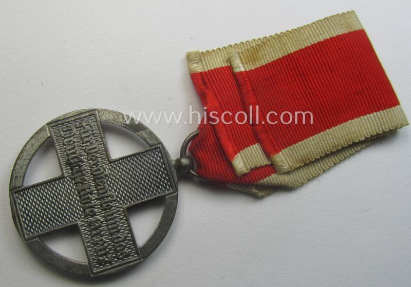 'DRK-Ehrenzeichen des 3. Modell' that comes together with its original (regular-sized- and period-mounted) ribbon (ie. 'Bandabschnitt') as issued and/or stored for decades