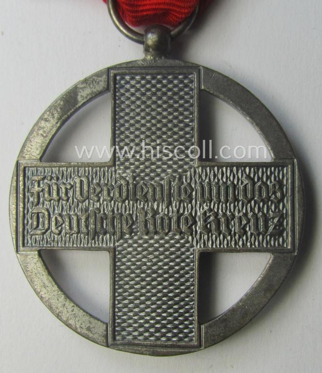 'DRK-Ehrenzeichen des 3. Modell' that comes together with its original (regular-sized- and period-mounted) ribbon (ie. 'Bandabschnitt') as issued and/or stored for decades