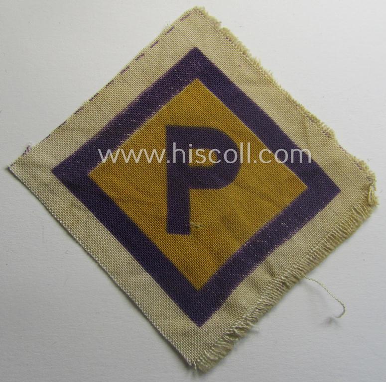 Printed-version of a so-called: 'P'- (ie. forced-labour) breast-patch (ie. 'Brustabzeichen für Poln. Zwangsarbeiter o. Fremdarbeiter') being a non-confectioned example that comes in a never used- (ie 'virtually mint'-), condition
