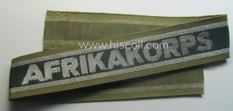 'BeVo'-like cuff-title (ie. 'Ärmelstreifen') entitled: 'Afrikakorps' being a presumably issued but simply never worn example that comes in an overall very nice- (ie. non-shortened- and never tunic-attached-), condition