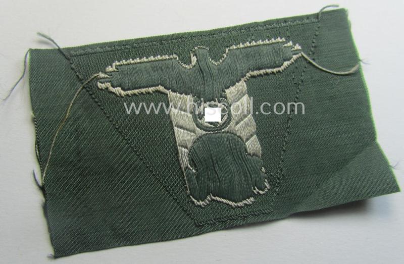 Superb - and simply never used nor cap-attached - Waffen-SS field-grey-coloured, M43-pattern cap-trapezoid as was intended for usage on the M43-model field-caps (ie. 'Einheitsfeldmützen') that comes in a 'virtually mint- ie. unissued', condition