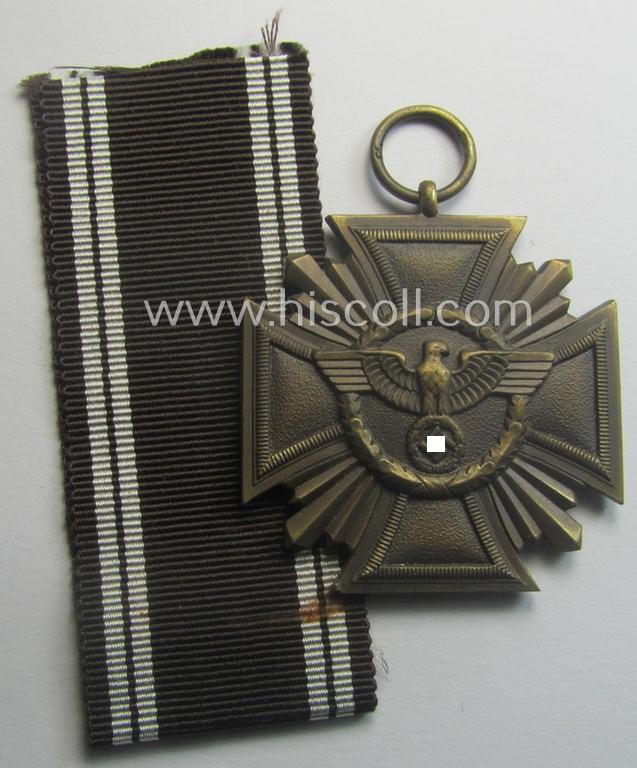 'N.S.D.A.P. Dienstauszeichnung in Bronze' (ie. '3. Stufe für 10 Jahre t. Dienste') being a maker- (ie. '53'-) marked- (and 'regular-weight' ie. 'Buntmetall'-based!) example that comes together with its period ribbon (ie. 'Bandabschnitt')