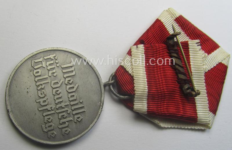 Unusually period-folded, single-pieced and non-detachable, medal-bar (ie. 'Orden- o. Einzelspange') showing a: 'Deutsche Volkspflege'- (ie. civil-service-) medal
