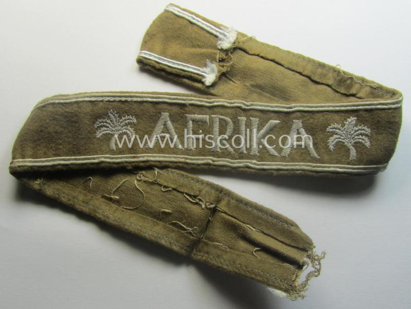 Moderately used, WH cuff-title (ie. 'Ärmelstreifen') entitled: 'Afrika' (being a hardly shortened example that comes in an overall very nice- (ie. issued and clearly worn ie. once tunic-attached-), condition