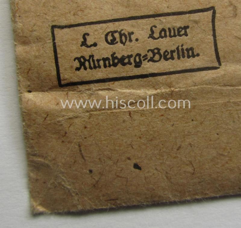 Fully complete, 'Feuerwehr-Ehrenzeichen der II. Stufe' that comes together with its shortened piece of ribbon (ie. 'Bandabschnitt') and (rarely seen!) period, 'Zellstoff'-based pouch as issued and/or recently found