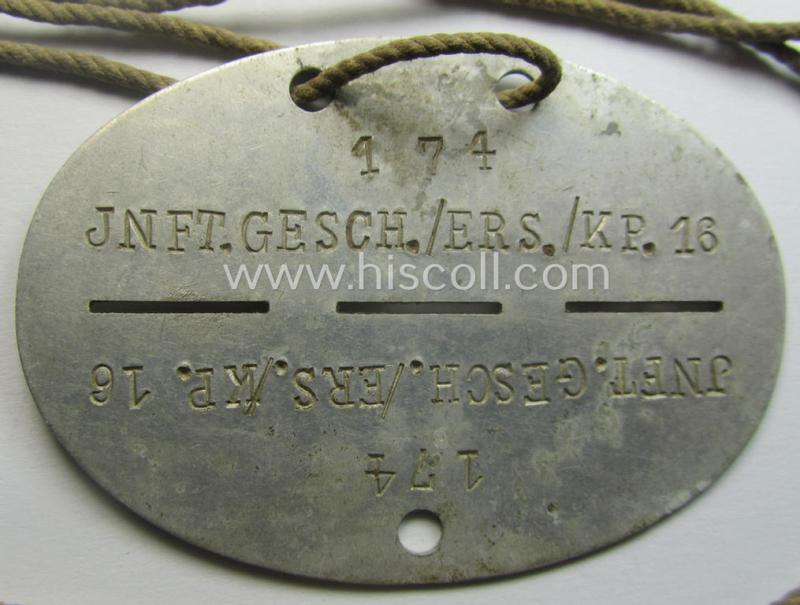 Aluminium-based, WH (Heeres) (ie. 'Infanterie-Geschütz-Ersatz'-related) ID-disc bearing the clearly stamped unit-designation that simply reads: 'Inft.Gesch./Ers./Kp.16' and that comes still mounted onto its (period-attached) cord