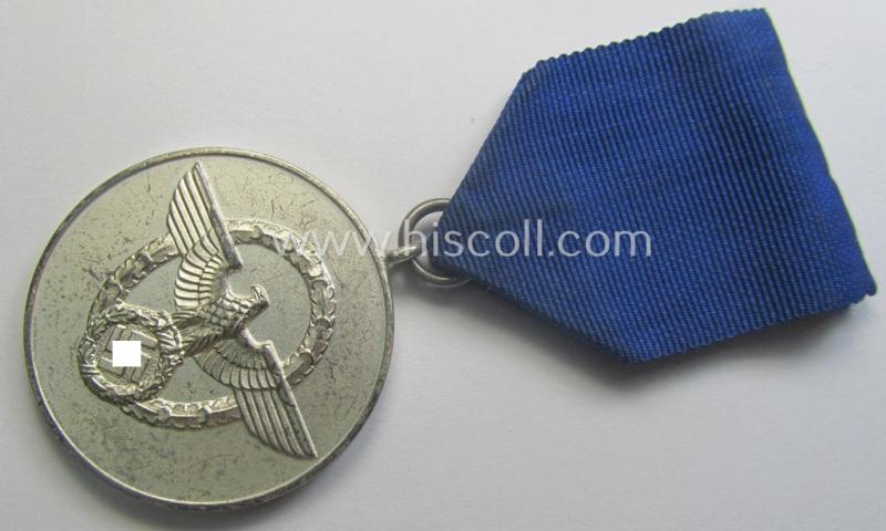 Bright-silver-toned so-called: 'Polizei-Dienstauszeichnung 3. Stufe' (or: police loyal-service medal 3rd class) that comes mounted onto its period ribbon (ie. 'Bandabschnitt')