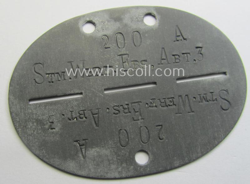 Zinc-based, WH (Heeres) '(Nebel)Werfer'-related ID-disc bearing the clearly stamped unit-designation that simply reads: 'Stm.Werf.Ers.Abt. 3' and that comes as issued and/or worn