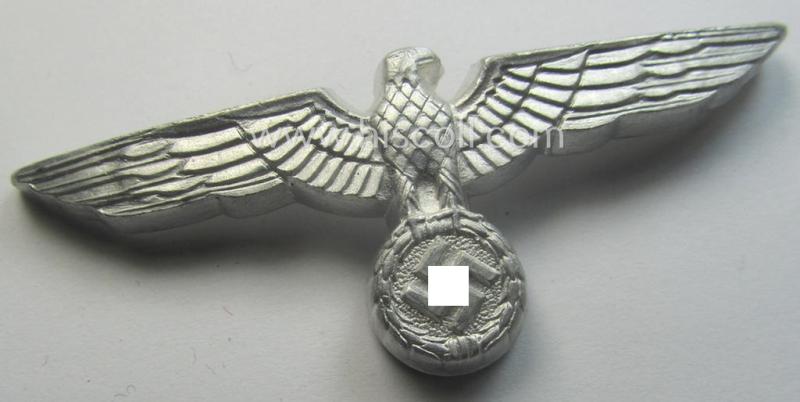 WH (Heeres) bright-silver-toned (ie. aluminium-based), EM- (ie. NCO- or officers') type visor-cap-eagle being a non-maker-marked example that comes in a never used- ie. (I deem) never cap-attached, condition