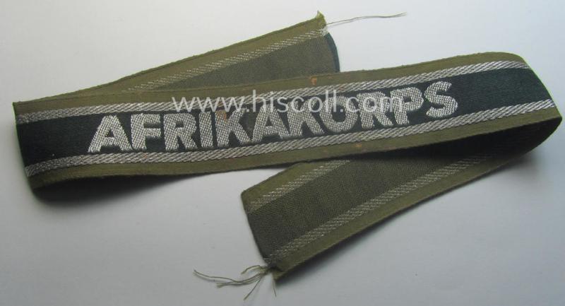 'BeVo'-like cuff-title (ie. 'Ärmelstreifen') entitled: 'Afrikakorps' being a presumably issued but simply never worn example that comes in an overall very nice- (ie. non-shortened- and never tunic-attached-), condition