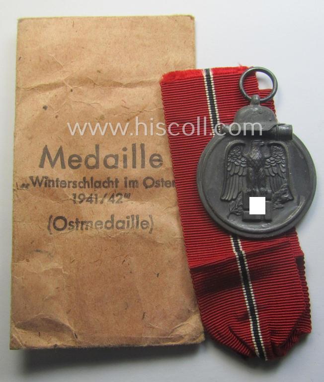 Fully matching medal-set: 'Winterschlacht im Osten 1941/42' as produced by the: 'Katz & Deyhle'-company being a clearly maker- (ie. '60'-marked) specimen that came stored in its original 'Zellstoff'-based pouch of issue as found