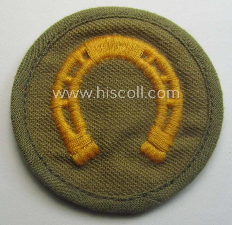 WH (Heeres) 'tropical'-issued, trade- and/or special-career insignia (ie. machine-embroidered 'Laufbahn- o. Tätigkeitsabzeichen') as was intended for an army: 'Hufbeschlagmeister' (or farrier)