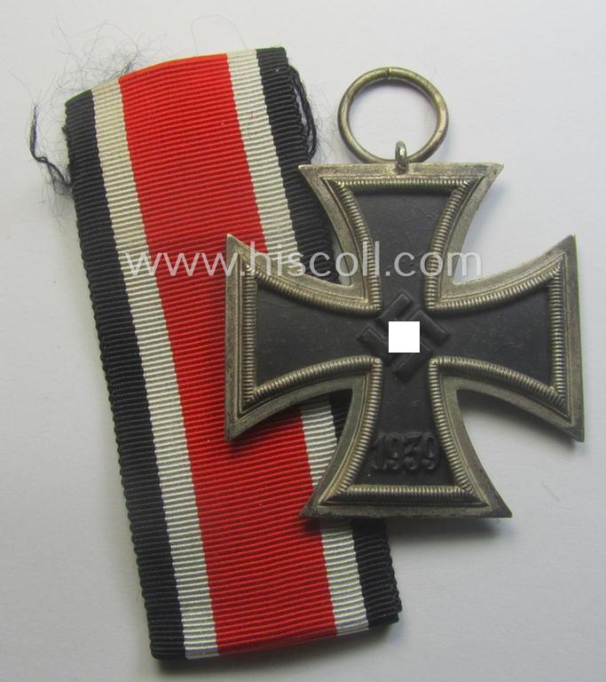 'Eisernes Kreuz II. Klasse' being a (typical) non-maker-marked example that comes together with its original- and never-mounted ribbon (ie. 'Bandabschnitt') as was produced by a (by me) unidentified maker (ie. 'Hersteller')