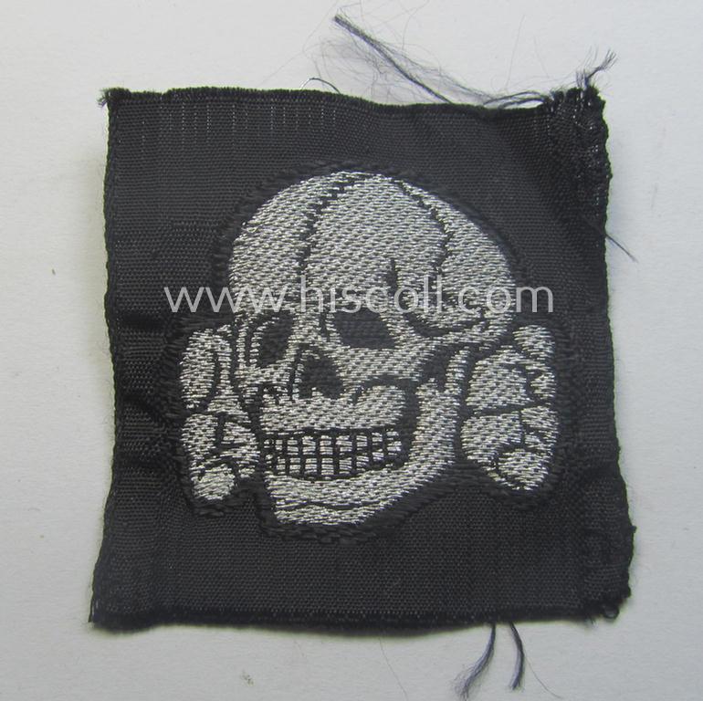 Stunning - and rarely encountered! - Waffen-SS, officers'-pattern, 'BeVo-flatwire'-woven-style skull (ie. 'Totenkopf für Offz.-Schiffchen o. Einheitsfeldmütze') that comes in a never used- (ie. still 'virtually mint ie. unissued'-), condition