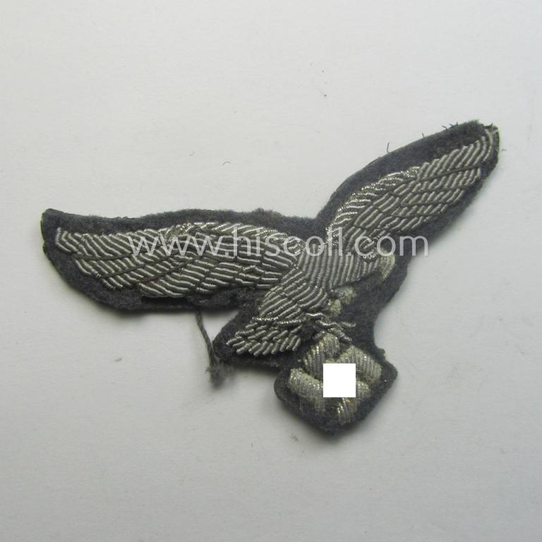 WH (Luftwaffe) officers'-pattern visor-cap-eagle (ie. 'Adler für LW-Offiziers-Schirmmütze') being a neatly hand-embroidered example of the: 'Extra Qualität' that comes in a moderately used- (ie. carefully cap-removed-), condition
