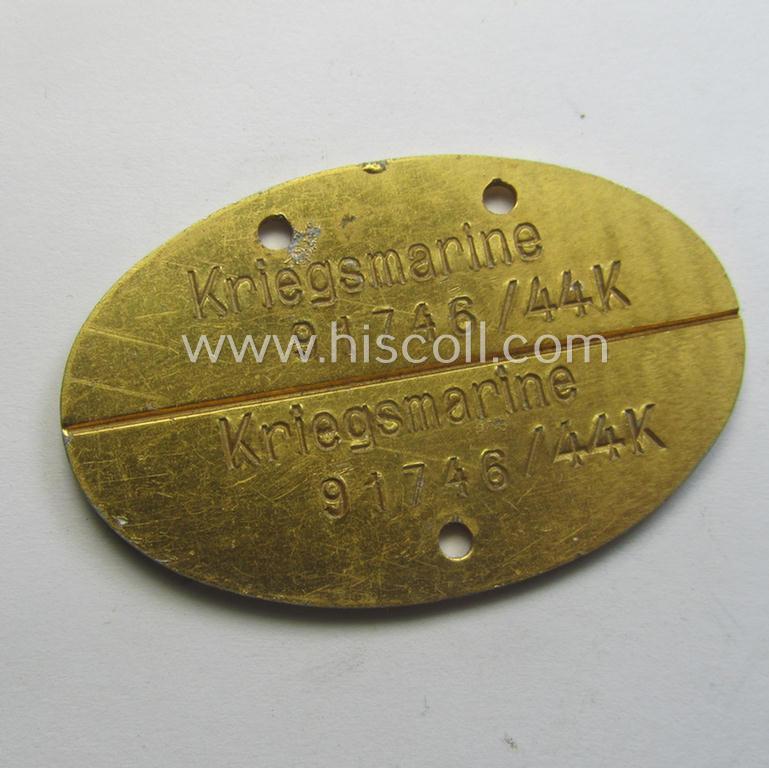 Later-war- (albeit 'standard-issue'-) pattern, WH (Kriegsmarine) typical aluminium-based- and/or bright golden-bronze toned ID-disc (ie. 'Erkennungsmarke') bearing the engraved coded numeral (ie. text) that simply reads: 'Kriegsmarine 91746/44 K'