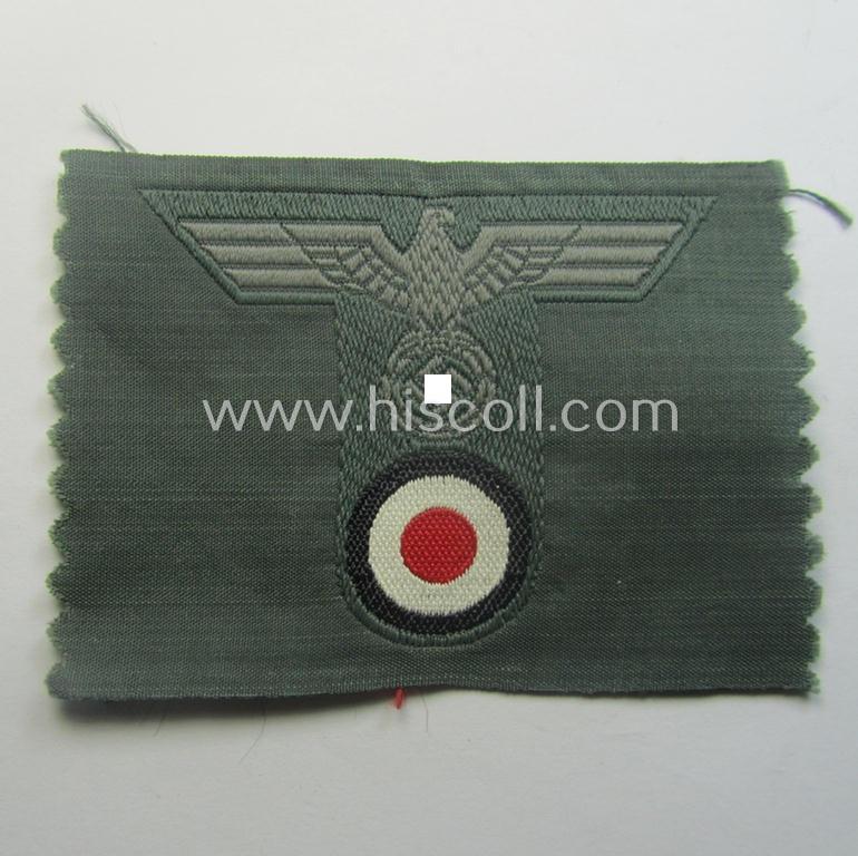 WH (Heeres) 'T-shaped' M42-model cap-eagle/cocarde as executed in 'BeVo'-weave pattern (being an attractive example that comes in a never used- nor cap-attached, condition)