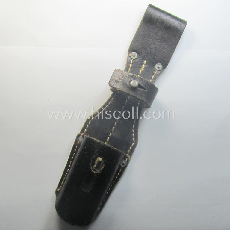 Genuine-leather-based- and/or black-coloured, 'standard-pattern' (and I deem later-war-period) WH (Heeres, Waffen-SS, Luftwaffe etc.) so-called: K98 bayonet-frog (ie. 'Tragetasche o. Koppelschuh') being a maker-marked (ie. 'RbN.'-numbered) example