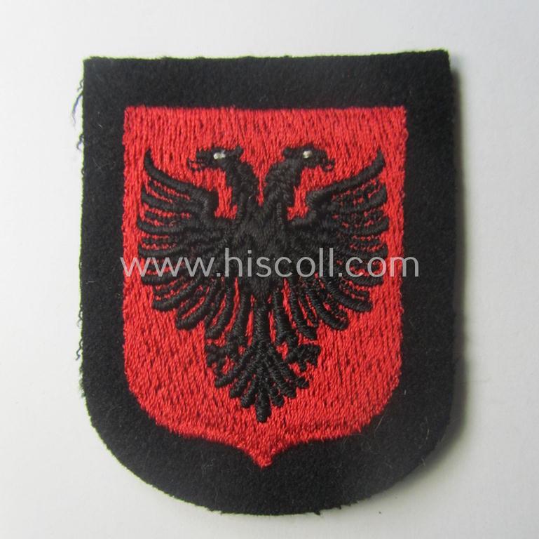 Waffen-SS 'volunteer'-arm-shield as was intended for usage by soldiers of the: '21. Waffen-Grenadier-Division der SS' “Skanderbeg” (ie. 'albanische Nr. 1') and that comes in a 'virtually mint- ie. unissued', condition