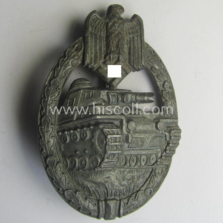 'Panzerkampfabzeichen in Bronze' being a clearly maker- (ie. 'KWM'-) marked (and/or: typical zinc- ie. 'Feinzink'-based-) example as was procuced by the: 'Karl Würster'-company