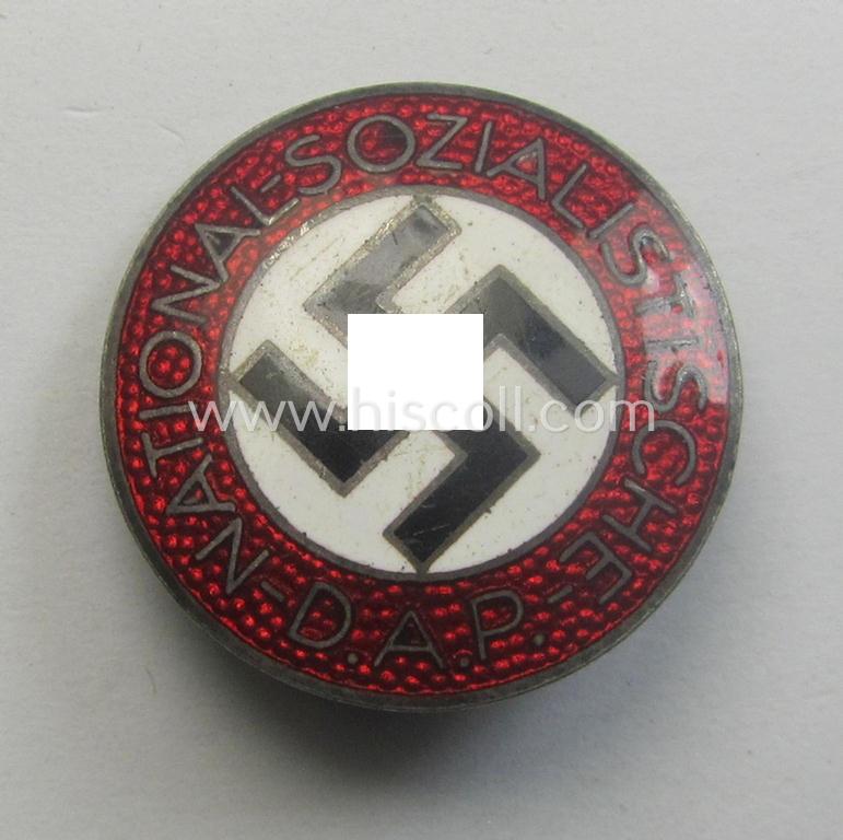 Neatly enamelled- (and bright-red-coloured!) 'N.S.D.A.P.'-membership-pin- ie. party-badge (or: 'Parteiabzeichen') which is nicely maker-marked on the back with the makers'-designation: 'RzM' and/or: 'M1/34'