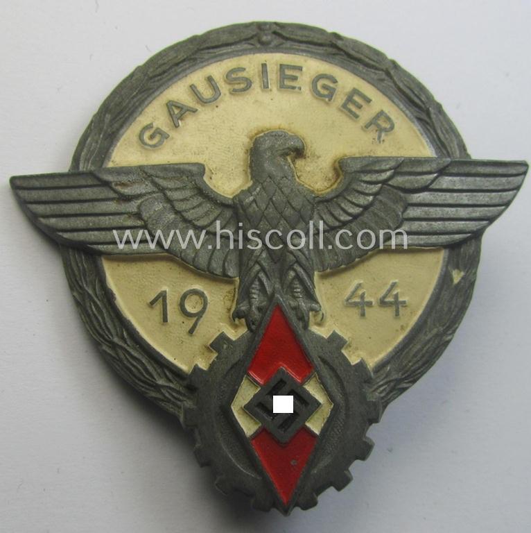Superb - and truly scarcely encountered! - 'Feinzink'-based HJ (ie. 'Hitlerjugend') so-called: 'Reichsberufswettkampf-Siegerabzeichen' of the 2nd model, 'Gausieger 1944', being a clearly maker- (ie.: 'Gustav Brehmer'-) marked example