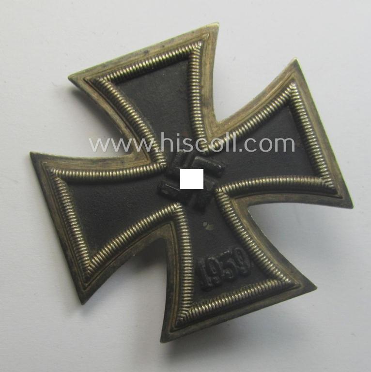 Fully untouched, 'Eisernes Kreuz 1. Kl.' (or: Iron Cross 1st class) being a typical, maker- (ie. '6.'-) marked example by the maker (ie. 'Hersteller'): 'Fritz Zimmermann' and that comes as issued and worn